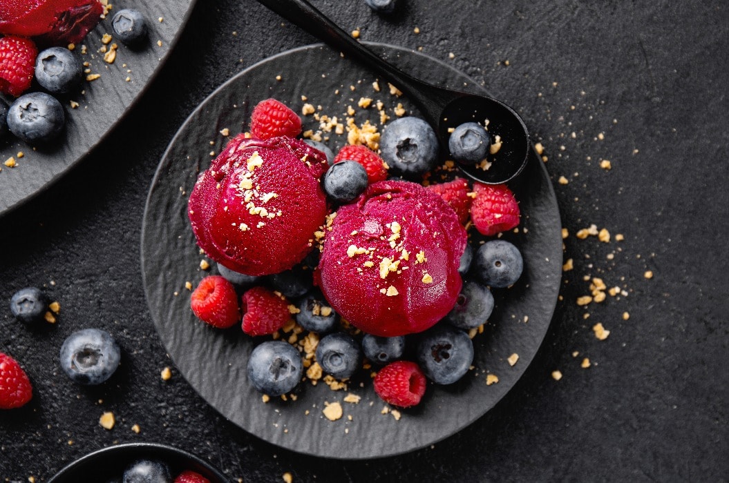 Berry refreshing ice cream scoops on plate